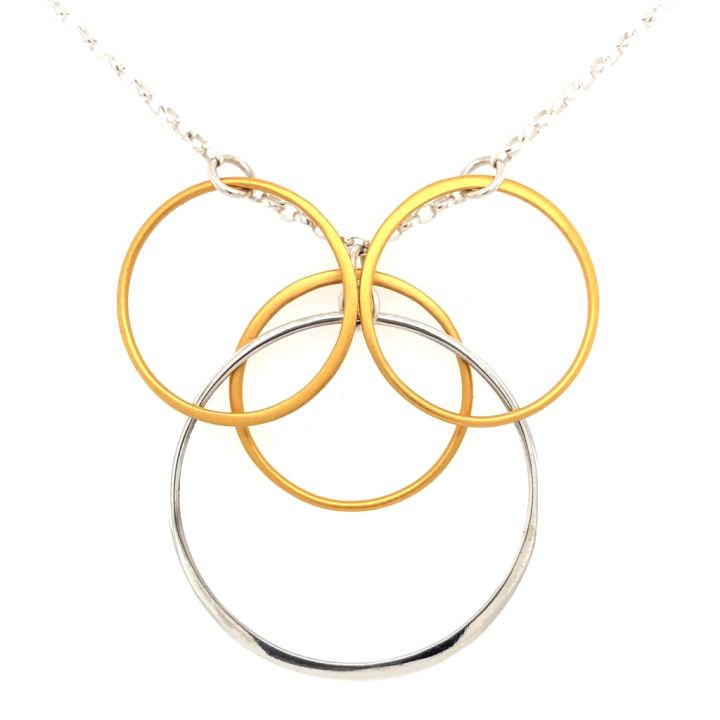 One sterling silver half-hammered 43 mm circle and three 14K satin gold plated 25 mm circles suspended on a twenty-eight inch sterling silver chain.
